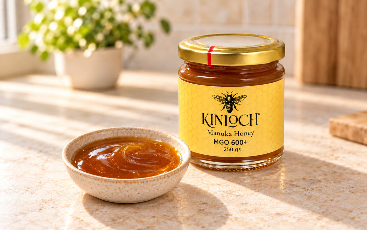 Kinloch MGO 600+ Mānuka honey showing its thick amber texture